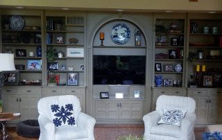 A large living room with interior painted cabinets
