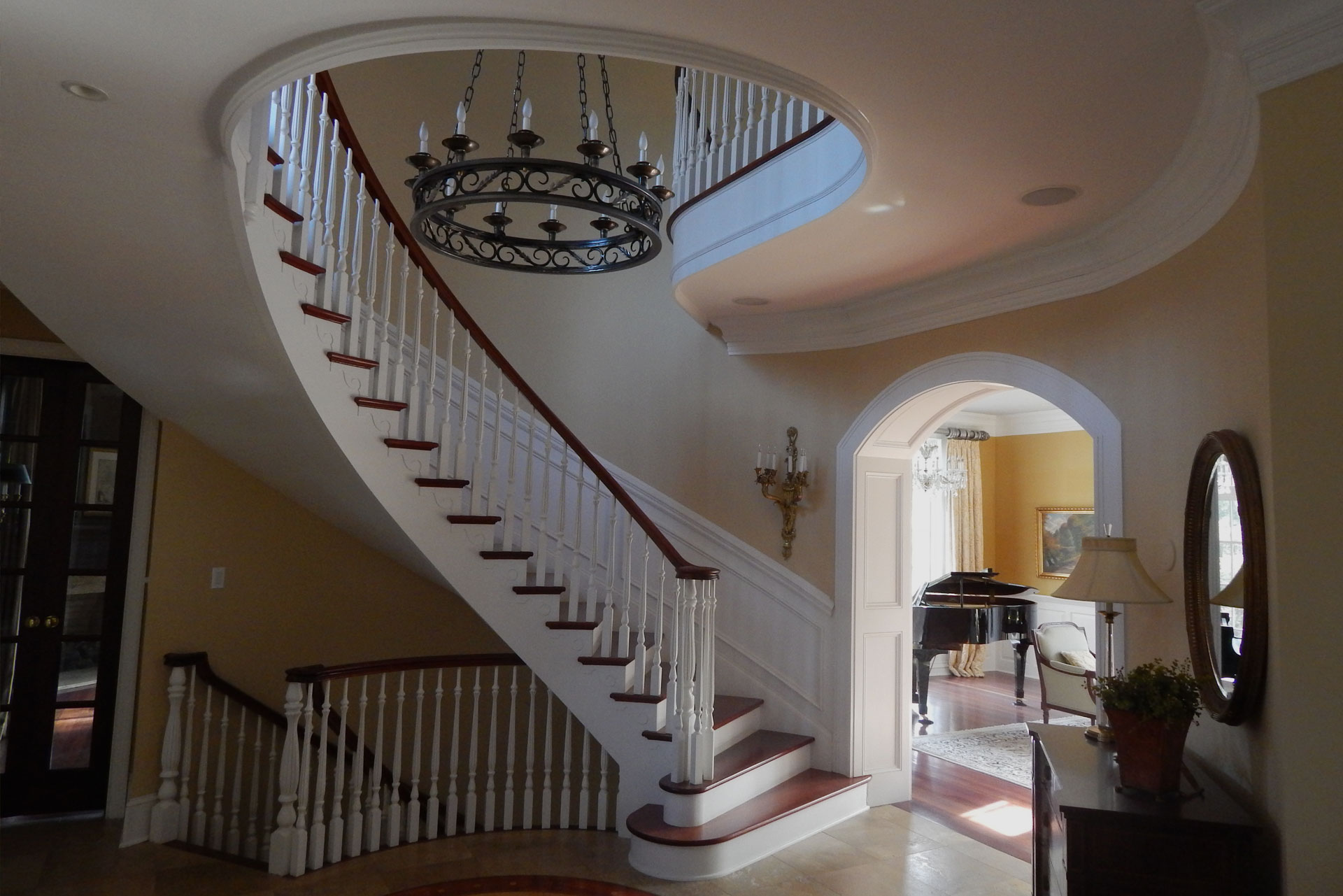 A spiral white stair case in a home